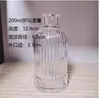 Botella de Aromaterapia Columna Romana de 100 ml al por mayor Botella de Vidrio con Raya Vertical Tarjeta de Material Blanco Fino Aromaterapia de Vidrio Romano