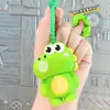 Novo chaveiro de silicone em formato de animal fofo de desenho animado, apresentando um pequeno dinossauro e urso, projetado para aliviar o estresse e ser divertido de apertar