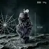 Calavera negra de Halloween sosteniendo una vela perfumada de rosa, vela decorativa con forma de calavera para ambiente de fiesta navideña