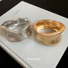 Pulsera Ovalada Abierta con Patrón de Martillo Irregular Metálico Europea y Americana Pulsera de Moda Versátil Pulsera de Diseño de Nicho