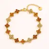 Pulseira de Trevo de Quatro Folhas com Pedras Totais de Alta Versão Moda Transfronteiriça para Meninas, Luxo Acessível e Pulseira de Flor de Aço Titânio Estilo Ins de Alta Qualidade