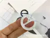 Botón de cintura de resina al por mayor de fábrica botón abrigo cortavientos palabra japonesa botón de tres botones esquina de camiseta botón de ajuste