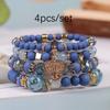 Pulsera de borlas con colgante de amor hueco multicapa de estilo bohemio de venta caliente europeo y americano, juego de joyería multicapa con cuentas de vidrio