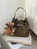 Bolso tipo cubo de alta gama para mujer 2026 nuevo estilo ins nicho bandolera bolso de mano de lujo ligero para el día a día colgante lindo