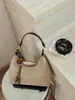 Bolso de mano de gamuza de moda en forma de media luna para mujer, bolso de hombro transfronterizo 2026 nuevo y moderno, bolso cruzado retro de nicho elegante