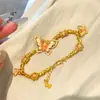 Pulsera de Mariposa Dorado Arena Rosa Morado Mismo Estilo de la Tienda de Oro Puzuo para Mujer, Dulce Nicho Elegante, Joyería de Mano Estilo Chino para Novia