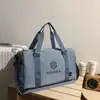 Bolsa de viagem de moda transfronteiriça nova de grande capacidade, moderna, casual, portátil, bolsa de ginástica, bolsa de ombro para armazenamento de bagagem, comércio exterior
