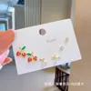 Pendientes pequeños de una semana, populares pendientes pequeños de aguja de plata S925, una tarjeta, tres pares de pendientes de combinación de traje, pendientes de circonita roja de red para mujer