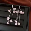 Pendientes de borla con flor de trébol de circonita vintage con un toque de alta gama, pendientes versátiles y de moda al por mayor