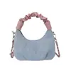 Bolsa tote dumpling popular deste ano com color-blocking para mulheres, nova bolsa transversal estilosa e versátil 2026, bolsa de mão pequena requintada super popular