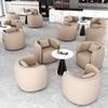 Sofá individual de cuero de lujo ligero, combinación de mesa y silla para recepción de hotel, salón de belleza, negociación, oficina