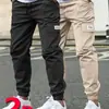 Calças Casuais Europeias Transfronteiriças para Homens, Calças de Trabalho, Calças Jogger de Marca da Moda, Corte Solto, Comprimento Cropped, Calças com Múltiplos Bolsos, Calças Jogger Esportivas