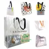 Bolsa de mano tejida de PP transparente con película pequeña para libros rojos bolsa de compras directo de fábrica bolsa tejida lote personalizado