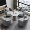 Sencillo y elegante conjunto de sofá individual y mesa de centro, adecuado para áreas de ocio, recepción de hotel, oficinas de ventas, salas de reuniones y salones de belleza.