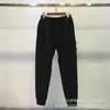 Calça de Moletom Funcional Casual Esportiva com Bolso com Zíper, Distintivo de Bússola de Pedra Europeia e Americana Transfronteiriça, Calça de Malha para Homens e Mulheres
