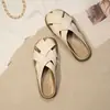 Verão 2026 Novo Estilo Calçável Francês Solado Macio Tira Cruzada Proteção para Dedos Meio Chinelos Sapatos Femininos Fundo Plano Sapatos Gaiola de Porco Sandálias