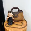 Elegante bolsa matelassê nova em blocos de cor com corrente, bolsa de mão quadrada pequena estilosa e versátil, bolsa de ombro e transversal da moda para mulheres