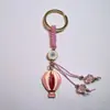 Colgante de Serie Ojo de Diablo Transfronterizo Europeo y Americano Colgante de Llavero de Joyería de Animales Ojo de Hueso con Goteo de Aceite Accesorios de Aleación para Mujeres