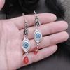 Pendientes colgantes retro simples de ojo del diablo, viento europeo y americano, ojos oscuros, lágrima, pendientes rojos