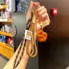 Miu Anillo de Llavero de Pan con Agua Alcalina Resina Pan Colgante de Llavero de Bolsa de Chocolate Regalo de Graduación