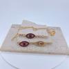 Collar Elegante con Colgante Único de Diseño Calado de Ojo de Diablo Transfronterizo Ins Europeo y Americano con Circonita Microincrustada Diamante Completo