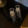 Aretes de Aguja Plateada con Borlas de Gota de Agua Incrustadas de Diamantes, Estilo Palacio, Nicho, Aretes Versátiles, Lujo Ligero, Venta al por Mayor de Aretes de Gama Alta