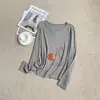 Camada base de gola V com abertura frontal, manga longa, cor sólida, camiseta interna simples para mulheres, novo top casual outono/inverno 2026, moderno