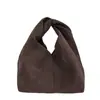 Bolsas de mano casuales de nicho al por mayor para mujer, nuevo bolso de fiesta de retazos de color sólido otoño 2026, monedero moderno