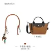 Solo se vende la bolsa interior - la bolsa exterior no está incluidaBolsa mini tipo dumpling Longchamp, Papel Dupont Longchamp