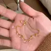Pulseira de Contas Redondas Estilo Palácio Levemente Luxuosa, Pingente Gota com Franja Dourada, Versátil e Fashion, Alto Valor Estético, Joia Delicada em Camadas para Mulheres