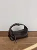 Bolso coreano de nicho, bolso de cuero genuino para mujer, bolso de hombro y cruzado versátil de moda, nuevo bolso de trabajo de verano 2026