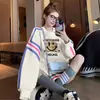 Suéter suelto de línea de color contrastante popular de este año para mujer, moda, cara sonriente, graffiti, largo, estilo extranjero, top Joker, tendencia
