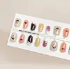 40 Piezas Puntas de Uñas Portátiles Pre-hechas con Relieve Ojo de Gato Uñas Postizas Manicura Francesa Almendra Pegatinas Liquidación de Stock