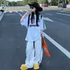 Camiseta de Manga Corta Holgada Estilo Street Dance para Niños y Niñas (Medianos y Grandes) 2026 Verano Nuevo Pantalones Casuales Modernos