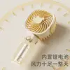 Nuevo ventilador pequeño de mano conveniente mini carga USB multifuncional para escritorio regalos de comercio exterior transfronterizo venta al por mayor