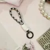 12CM cordão de celular com nó de cores combinadas criativo curto trançado para capa de celular chaveiro alça anti-perda removível