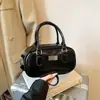 Bolsa Pequeña de Mano para Jugador de Bolos Transfronterizo para Mujer 2026 Nueva Versátil Textura Bolso de Hombro Único Bolso Cruzado Boston