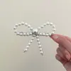 Pinza para el pelo de lazo de perla dulce y elegante, pinza superior de temperamento femenino, pinza de resorte para la parte posterior de la cabeza, accesorios para el cabello con sentido avanzado