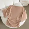 Top de lyocell estilo francés con hombros descubiertos y mangas acampanadas