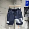 Nuevos pantalones cortos de seda helada de secado rápido para hombre, elásticos, alta calidad, pantalones de cinco puntos, pantalones de playa finos, pantalones de longitud media, marca de moda