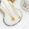Popular en Xiaohongshu: Colgante de estrella de ensueño de cristal de hielo deslumbrante de arena dorada estilo antiguo, collar de estrella hueca simple y versátil