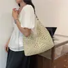 Bolsa tejida popular de celebridad de internet de gran capacidad para mujer 2026 Verano Nuevo Bolso de hombro único de paja Informal Bolso de playa para el mar