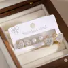 Brincos de aço inoxidável, best-seller transfronteiriço europeu e americano para mulheres, brincos em formato de coração banhados a ouro com detalhes em diamantes inteiros, conjunto de brincos de três peças estiloso e único