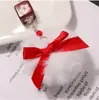 Estilo Año Nuevo Creativo Femenino Llavero Colgante de Pompón Lindo Cordón para Teléfono Estuche para Auriculares de Pareja Decoración de Bolso