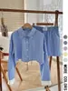 Comercio exterior transfronterizo estilo europeo y americano ropa de mujer primavera y verano nuevo traje de camisa de manga larga a rayas de color de contraste pantalones cortos a rayas de color de contraste