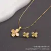 Colgante Ojo de Gato Forma de Gota Pendientes de Trébol de Cuatro Hojas para Mujer Set de Dos Piezas Popular Cadena de Onda de Agua de Comercio Exterior Collar con Piedra Preciosa