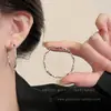 Pendientes de anillo liso exagerado con aguja de plata S925 de estilo europeo y americano para mujer, pendientes de temperamento simple Joker de lujo ligero de alta gama, venta al por mayor