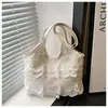 Bolsa Coreana de Nicho Estilo Suave Casual para Férias Renda Tecida para Mulheres 2025 Nova Bolsa de Praia Fada de Alta Aparência