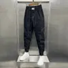 Pantalones holgados tipo harén con tobillo atado de estilo coreano para hombre, pantalones ajustados de línea brillante versátiles para jóvenes, pantalones casuales con tobillo atado de celebridad de Internet