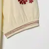 Camiseta de Mujer Elegante de Manga Corta Holgada Bordada Cuello en V Estilo Europeo y Americano Transfronterizo 2026 Nueva Moda 3969021